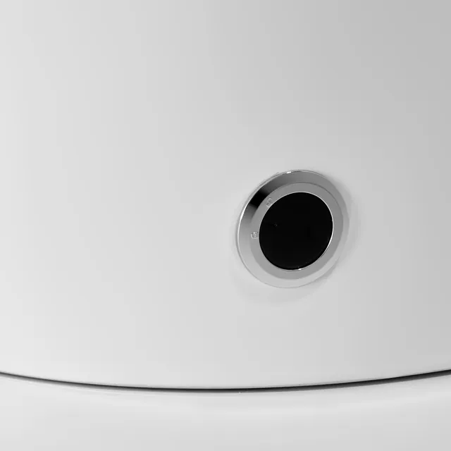 Close-up of a round button at the base of the K73
